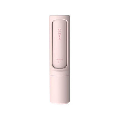 Tape-free reusable pet hair remover lifting embedded fur from upholstery fabric