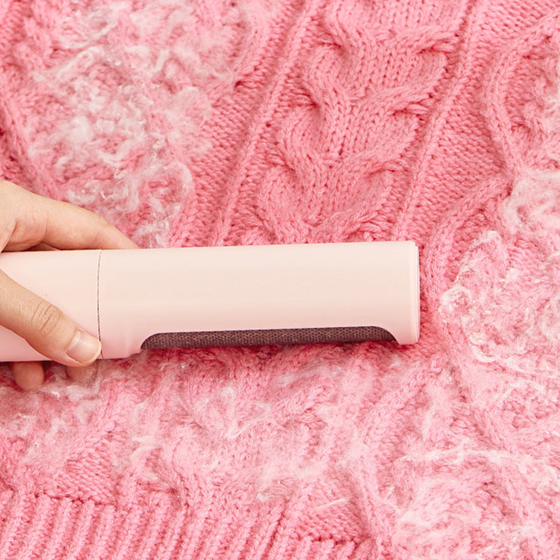 Self-cleaning pet hair remover with one-touch button to empty collected fur