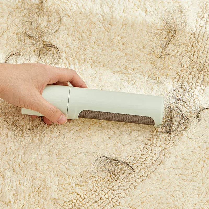 PawGloss self-cleaning roller in use - removing dog and cat hair from jacket
